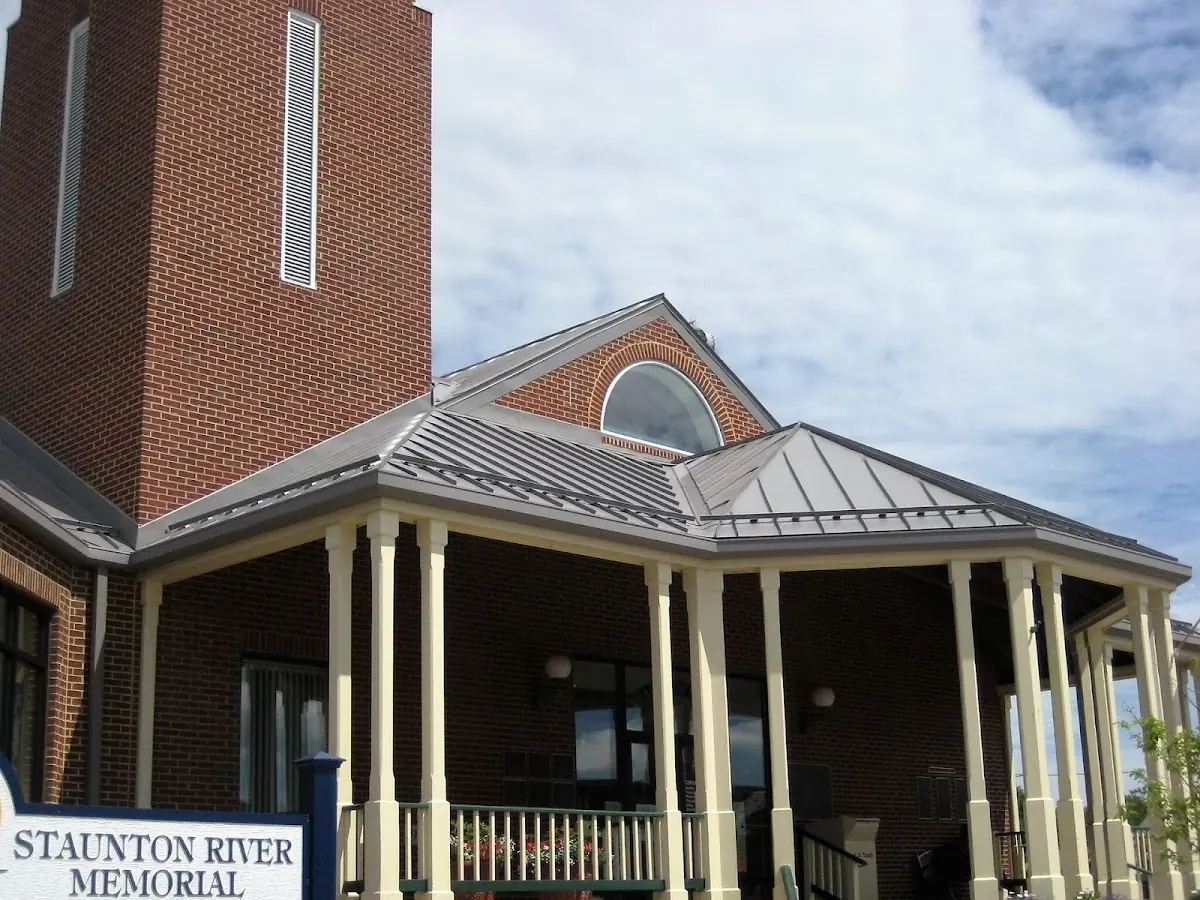 Skilled roofing craftsmen working on a residential roof in University